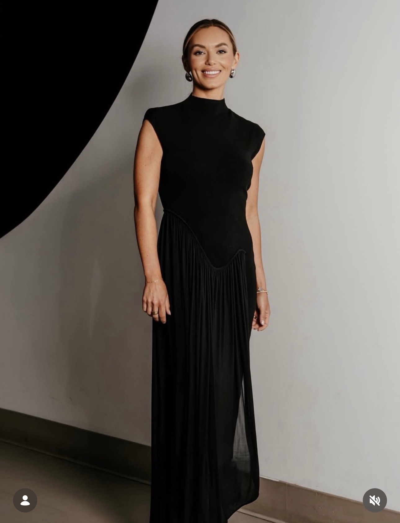 Smiling woman in an elegant black dress